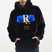 a man wearing a black hoodie with roses on it